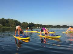 unky Buddha Yoga offers summer classes at Reed's Lake that combine your love of yoga with stand up paddle boarding.