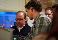 One of Startup Weekend’s organizer, Aaron Schaap, right, talks with a team about their business idea at a previous year’s event.