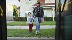 Paola Mendivil and her son getting on the bus in Grand Rapids