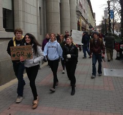Protester march down Monroe Ctr.