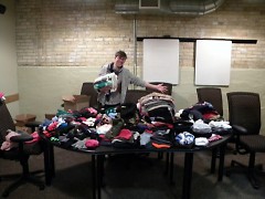 @Teresa Z helps organize the winter supplies that Spectrum Health delivered!