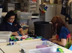 WMCAT fashion design students working on exhibit projects.