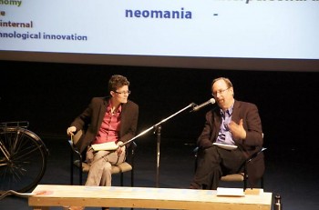 Lambert (right) on stage with GVSU professor Anna Campbell at the symposium.