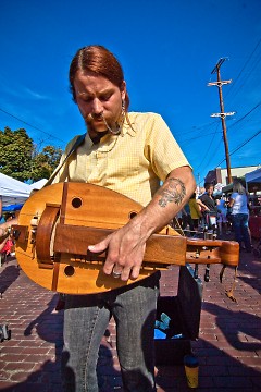 Jesse Macintosh plays his hurdy gurdy on the Wealthy Street during Eastown Street fair 2009