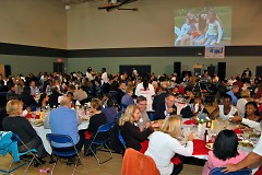 Over 240 sponsors/guests and 120 Club members enjoying dinner together while watching a presentation featuring our youth.